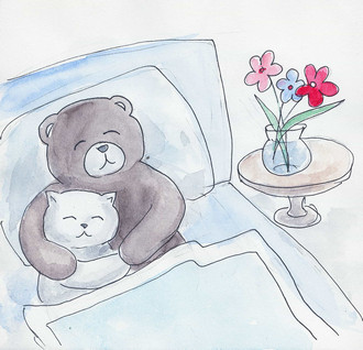 A cat & a bear sleeping in bed